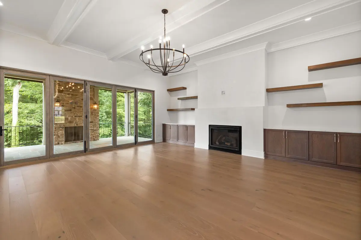 Living room with large glass windows and doors letting in natural light